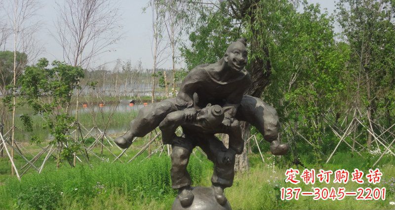 荆州园林站在球上面跳山羊的人物景观铜雕